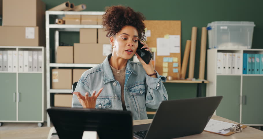 Stress, phone call and black woman on laptop for shipping, distribution and courier service. Ecommerce, small business and person on smartphone for communication, logistics and order with boxes