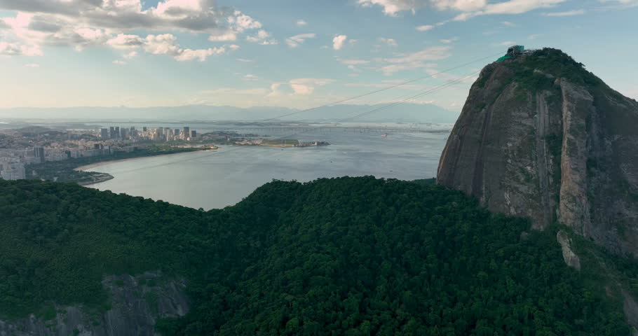 Flying up to the top of the Sugar Loaf mountain at late afternoon light, Rio de Janeiro