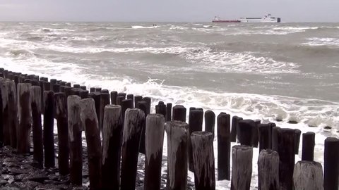 Wooden groynes and basalt on the North Sea