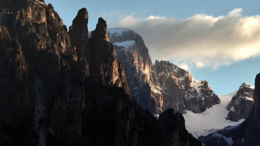 Aerial view of the beautiful landscape of the Dolomites in Italy. The peaks of the rocky mountains at sunset are untouched by nature. High quality 4k footage