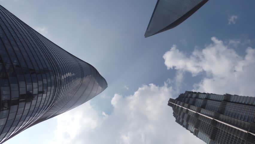 Down top view of downtown Shanghai three skyscrapers the Jin Mao Tower the World Financial Center and the Shanghai-tower the tallest towers in largest city on the earth high resolution footage