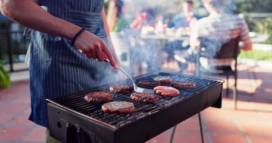 Grill, burger and barbecue dinner for party, meat and outdoor backyard cookout. Flames, food and smoke for bbq, bonding and relax cooking with traditional American culture for Independence day
