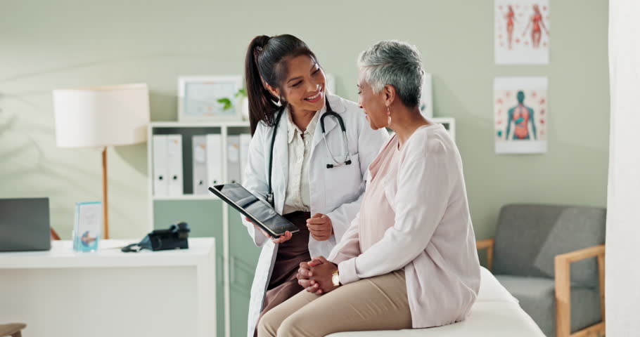 Discussion, tablet and doctor with senior patient in hospital office for diagnosis, surgery or treatment. Consultation, professional and healthcare worker with woman on digital technology in clinic.