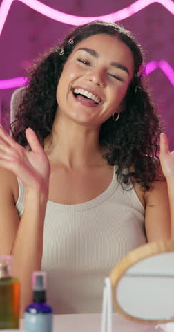 Girl, talking and influencer with live streaming, online and video for fans, cosmetics and social media. Home, skincare and advice for makeup, content creation and beauty in portrait in apartment