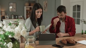 Couple prepare documents for work have coffee and breakfast at home - Powered by Shutterstock - Get 15% off with code: PIKWIZARD15