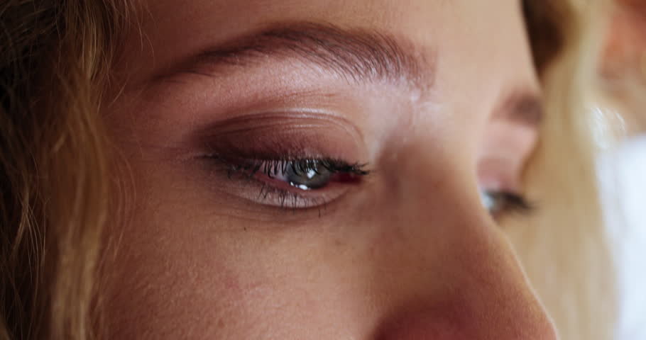 Eyes, sad and closeup of woman with crying for broken heart, depression or mental health burnout. Female person, anxiety and tired in tears with thinking for emotional problem, bad news or memory