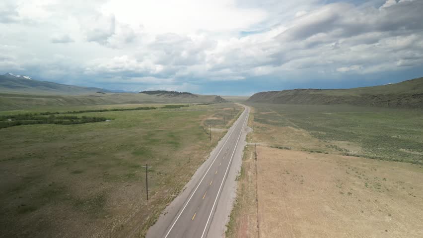 Aerial above Highway 28 through Lone Pine Idaho in spring time
