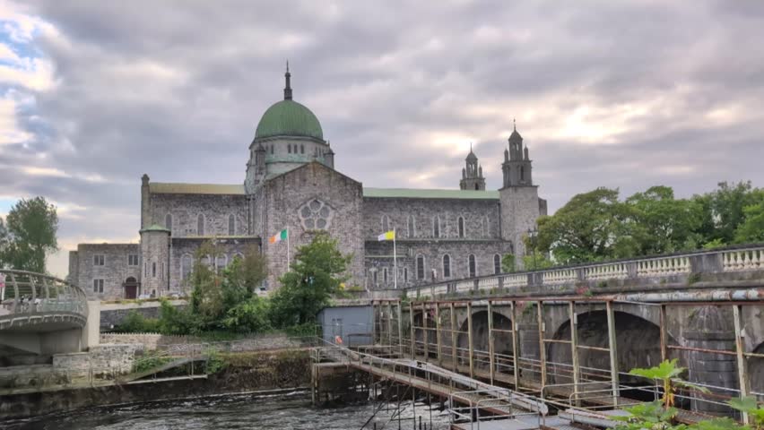 Galway cathedral b y the Corrib river in Galway city, Ireland, Irish landmark, buildings and architecture, 4k, revealing 