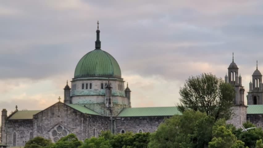 Galway cathedral b y the Corrib river in Galway city, Ireland, Irish landmark, buildings and architecture, 4k, revealing 