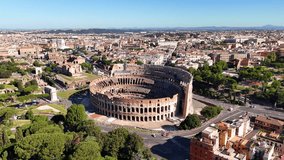 Aerial view of the Colosseum in Rome, one of the most iconic wonders of the world. The drone is slowly circling over the ancient amphitheater of the Roman Empire. Rome, Italy - Powered by Shutterstock - Get 15% off with code: PIKWIZARD15