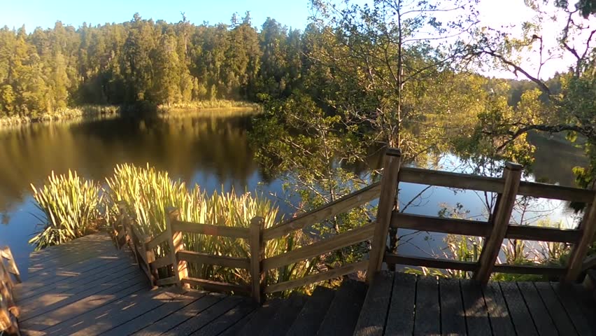 Footage of Lake Matheson with the southern alps in the background