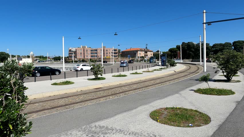 Discover the haunting beauty of urban desolation with this stock video featuring a deserted city center, intersected by silent tram tracks.