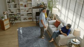 Happy senior asian husband and wife have fun sing and dancing in living room together at home.Overjoyed happiness Elderly asian couple retirement feel energetic active enjoy family retirement weekend. - Powered by Shutterstock - Get 15% off with code: PIKWIZARD15