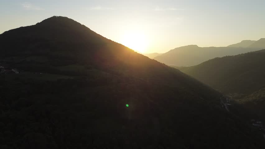 Cinematic drone shot of a montain during sunset