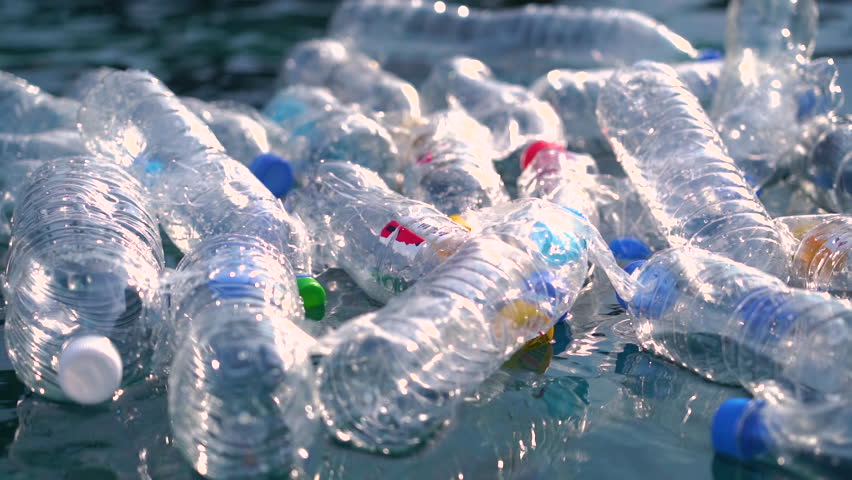 Garbage floating on the coast. Environmental pollution Rubbish plastic bottles. Plastic pollution trash in ocean.  Problem of ecology. 