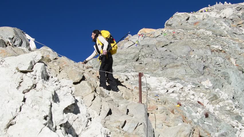 Young caucasian woman trekker struggle from altitude sickness on trekking to Gokyo ri village.Khumjung glacier and Cho la Pass top viewpoint