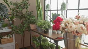 Bearded man arranging flowers in a vibrant indoor florist shop with green plants - Powered by Shutterstock - Get 15% off with code: PIKWIZARD15