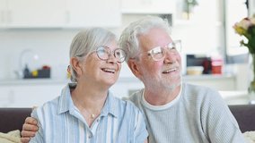 Dreamy middle aged senior loving retired family couple looking in distance, planning common future or recollecting memories, enjoying peaceful moment relaxing together on cozy sofa in living room
 - Powered by Shutterstock - Get 15% off with code: PIKWIZARD15