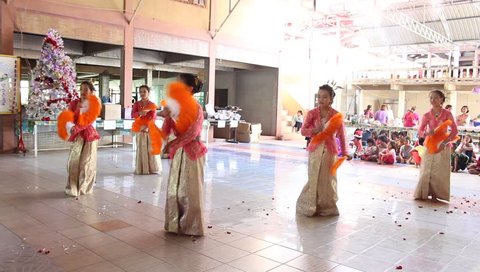 Angthong, Thailand - December 2012 : Thai traditional dancing by Orphans at Wat Tarn Jet Cho Temple.