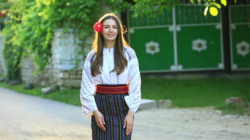 Beautiful traditional costume from Republic of Moldova. Young girl wearing Romanian traditional blouse.