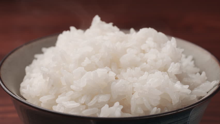 Steam Rising from Freshly Cooked White Rice