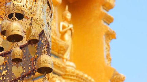 old brass Buddhist bells in thai temple