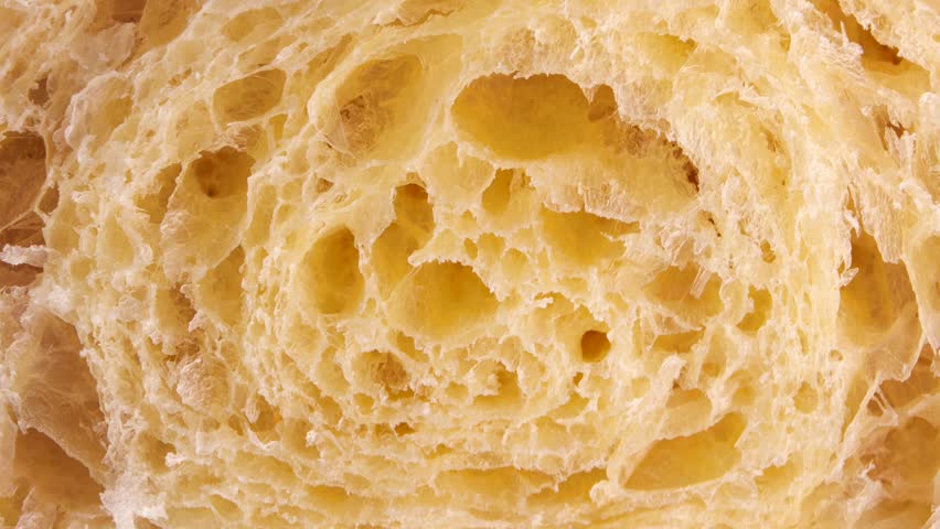 Cake Texture, rotation in circle. the cross section of the puff pastry dough, Turning. selective focus. croissants cross section