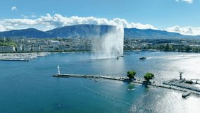 an Aerial shot over a fountain in geneva lake, switzerland - Powered by Shutterstock - Get 15% off with code: PIKWIZARD15