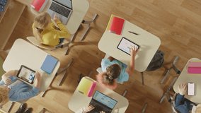 Top-down View of Children in Classroom Use Tablets and Laptops, Connectivity by Lines of AI Data, Information. Diverse Kids Study with Interactive E-Learning, Modern Education, Digital Literacy - Powered by Shutterstock - Get 15% off with code: PIKWIZARD15