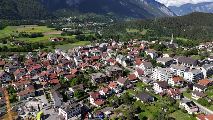 Charming aerial view of Bonaduz, Switzerland, showcasing a picturesque village and mountainous backdrop