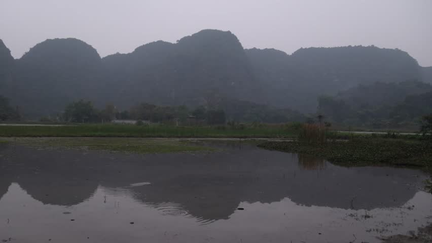 reflection of mountains in the river in the mountainous region of Ninh Ninh in Northern Vietnam