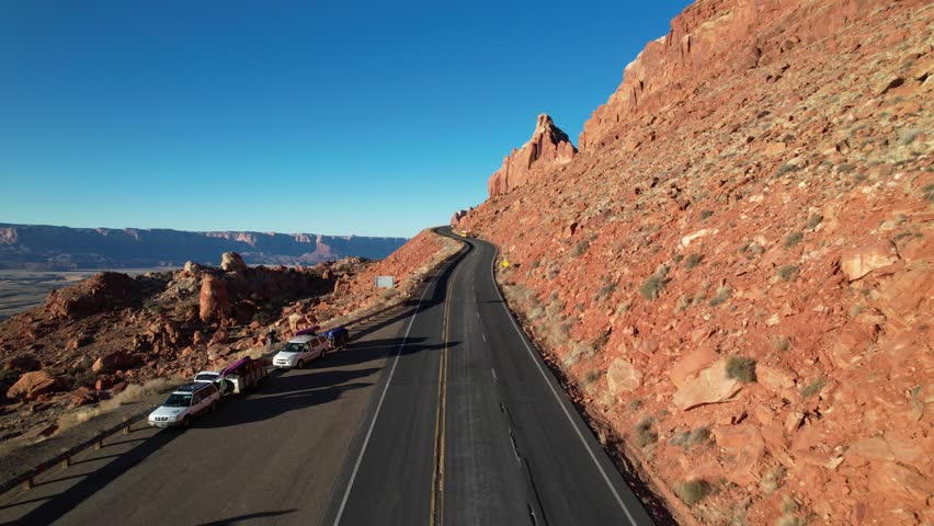 A footage of a road by the Grand Canyon Walls at Sunrise by drone in Grand Canyon national park, Arizona, USA