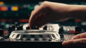 Vibrant DJ Mix Performance Closeup view of hands and equipment during a live music performance, city event, dj set in music techno club - Powered by Shutterstock - Get 15% off with code: PIKWIZARD15