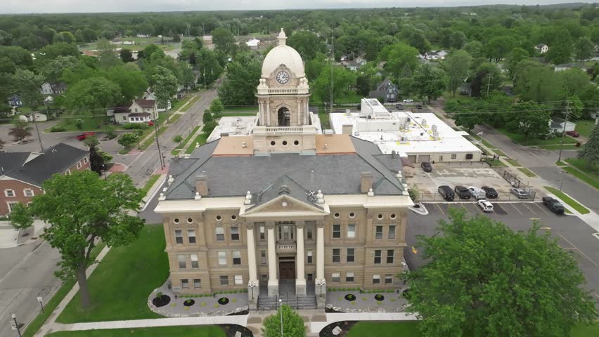 Shiawassee County historic courthouse in Corunna, Michigan with drone video pulling back.