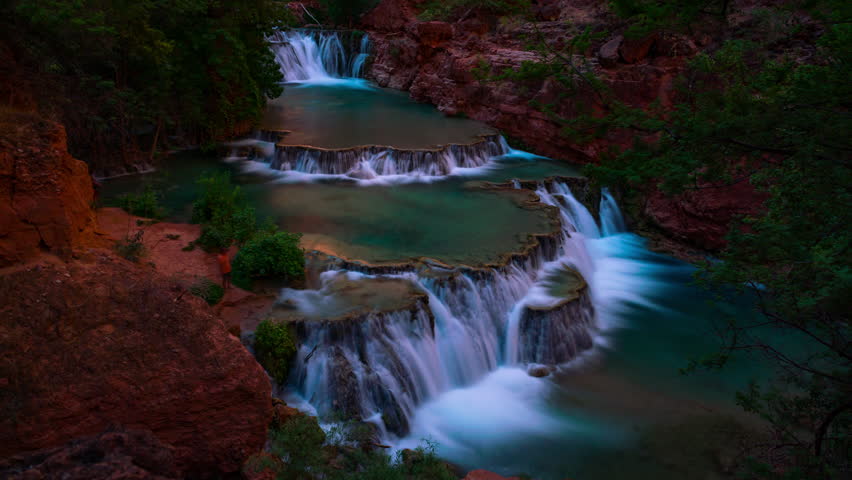 Timelapse long exposure shot of sunlight revealing magnificent terrace waterfalls in Grand Canyon in Arizona, USA
