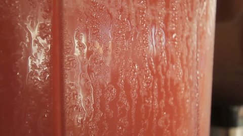 extremem cu on a moist juice machine contatining red grapefruit juice