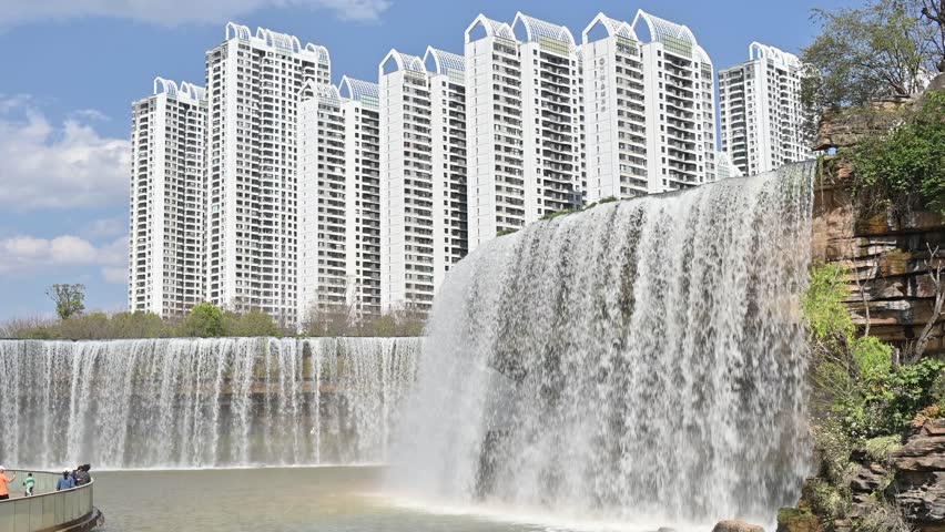 Beautiful view of Kunming waterfall park in China. The waterfall is claimed to be the largest man-made one in Asia which is 12.5 meters in height and 400 meters in width.
