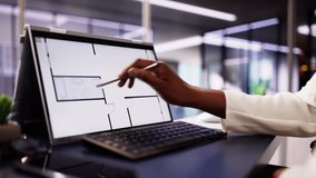 Analyzing House Floor Plan On Digital Tablet: African-American Architect Renovating Hybrid Property for Real Estate Business with Designer. - Powered by Shutterstock - Get 15% off with code: PIKWIZARD15