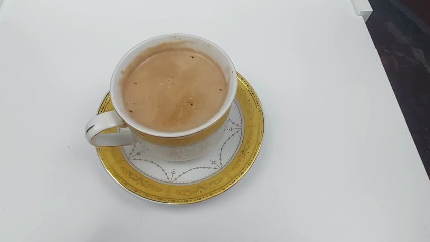 Cappuccino coffee in a white glass will be taken on the table