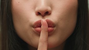 Silence gesture extreme close up female mouth Asian chinese korean japanese woman unrecognizable lady girl hush lips keep secret silent whisper quite secrecy confidential mysterious model face details - Powered by Shutterstock - Get 15% off with code: PIKWIZARD15