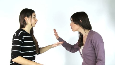 Two girlfriends arguing isolated/Two women friends talking loud starting fight