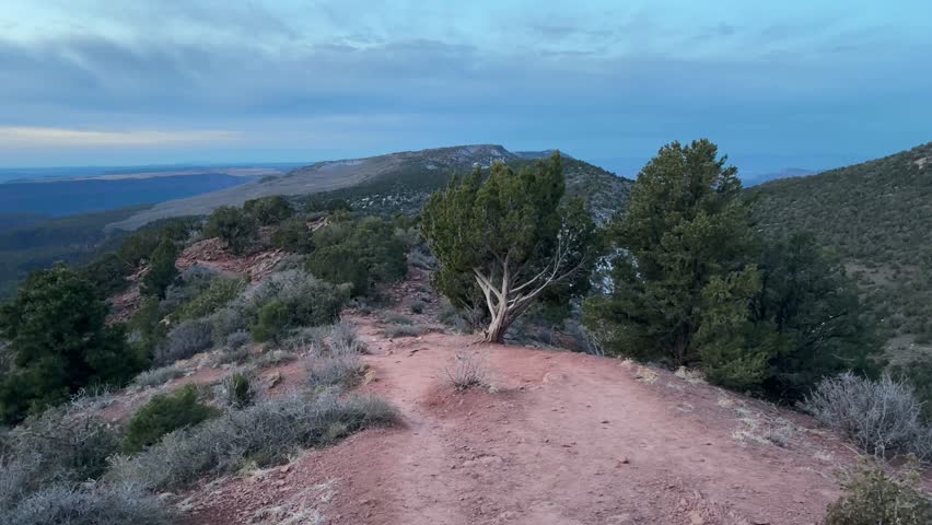 Point of View POV shot of a hiker walking on a red rock dirt trail in Kolob Canyons in Zion National Park, Utah, USA