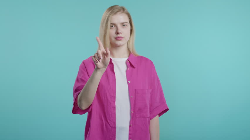 Uninterested woman disapproving with NO finger sign gesture. Enough, rejecting