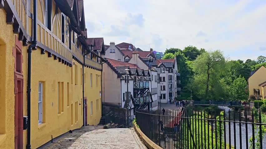 Dean Village in the historic Edinburgh, Scotland. Slow motion walking approach.