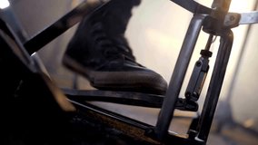 Close-up of drummer's feet pressing pedals of bass drum and hi-hat A professional musician plays with foot on drum pedal. Musician hobby background - Powered by Shutterstock - Get 15% off with code: PIKWIZARD15