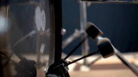Man playing base drum pedal on stage Close-up, Drummer playing drum set beater strikes rhythmically against red bass kick drum. music concept background - Powered by Shutterstock - Get 15% off with code: PIKWIZARD15