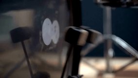 Close-up of drummer's feet pressing pedals of bass drum and hi-hat A professional musician plays with foot on drum pedal. Musician hobby background - Powered by Shutterstock - Get 15% off with code: PIKWIZARD15