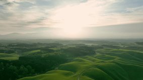 Drone aerial shots of spectacular greenery landscapes and morning sun rising in the sky. Dynamic natural scenery. - Powered by Shutterstock - Get 15% off with code: PIKWIZARD15