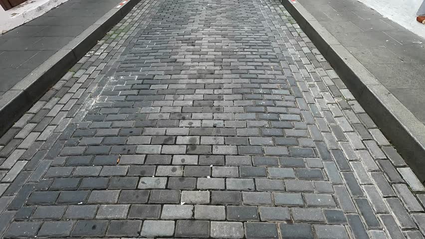 walking down street in old san juan puerto rico (beautiful cobblestone alley path with colorful colonial historic spanish homes) buildings downtown caribbean island travel tourism destination getaway