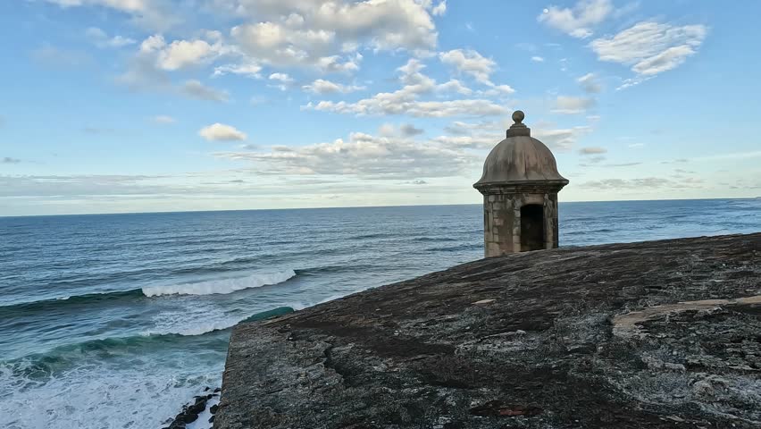 view of waves crashing on the shoreline from castillo san felipe del morro in old san juan puerto rico (tropical island beach coast) historic fort castle travel tourism national park destination trip